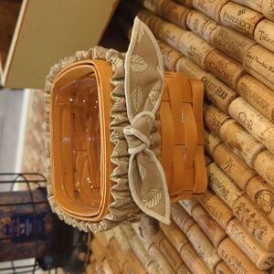 Longaberger 1999 Teaspoon basket w garter, protector and card.